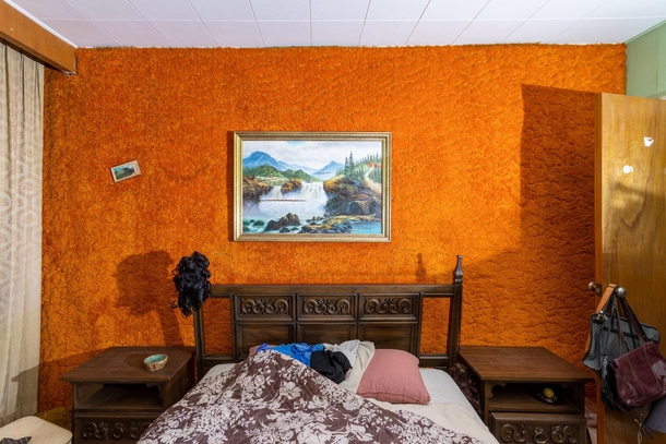 Bright Orange Carpeted Walls in this Abandoned House Bedroom