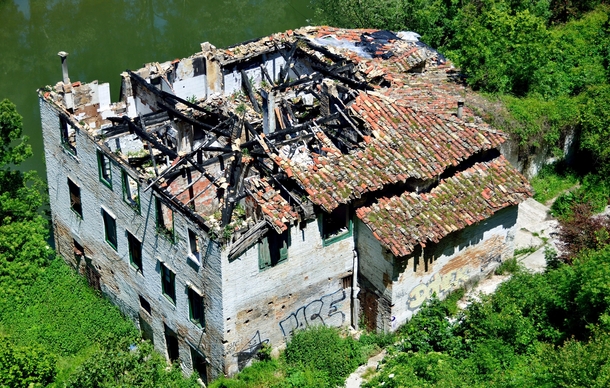 Burnt out building on the river in Pamplona Spain  OC