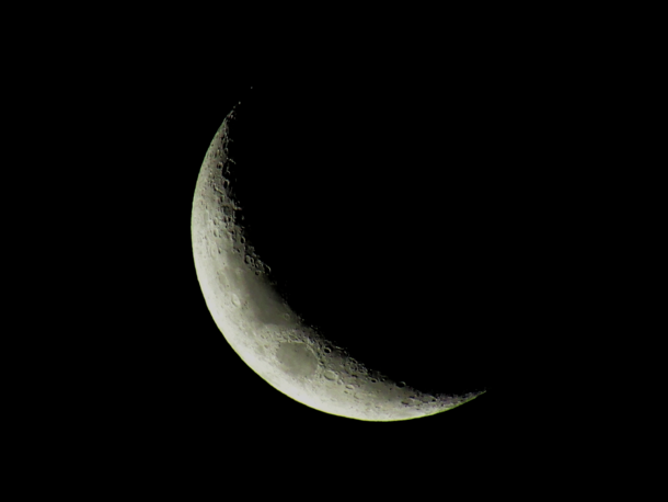 Captured the crescent Moon in my backyard with only a cheap digital camera and im dazzled 