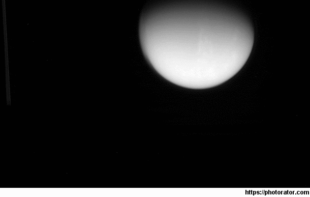 Cassini captured Titan setting behind Saturn
