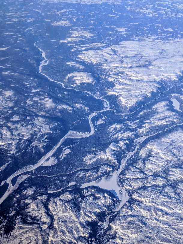 Caught a glimpse of this icy landscape on my flight over Newfoundland Canada 