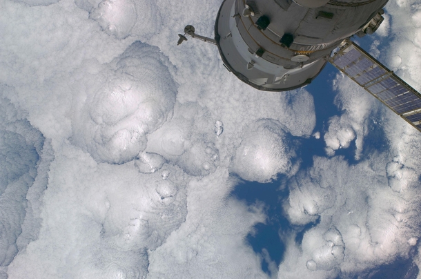 Cellular cloud patterns and a Progress resupply vehicle over the South Pacific