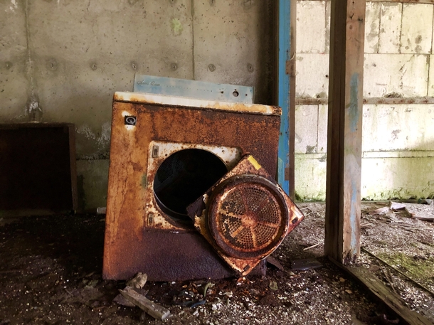 Clothes dryer in front of an abandoned apartment