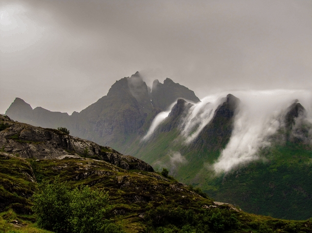 Clouds flowing down the mountain Lofoten Island 
