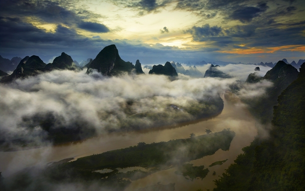 Clouds hang low above the Li River China  by Thierry Bornier x-post rChinaPics