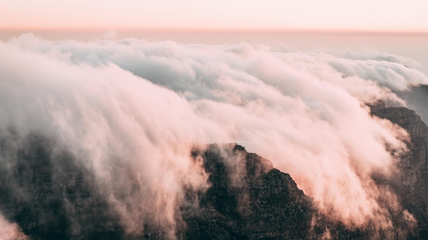 Clouds literally running over the edge of Table Mountain Capetown  effectfoto
