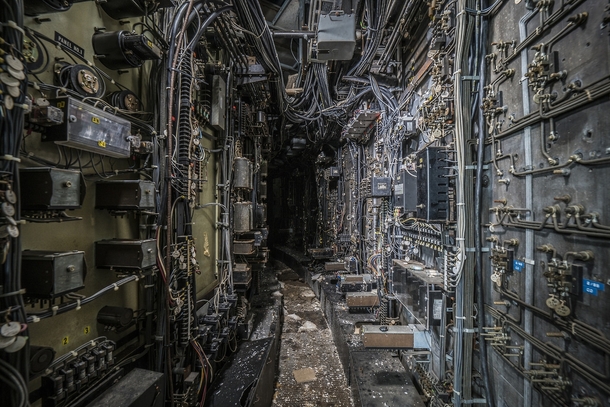 Computer wiring tunnel inside an abandoned coal power plant photo by