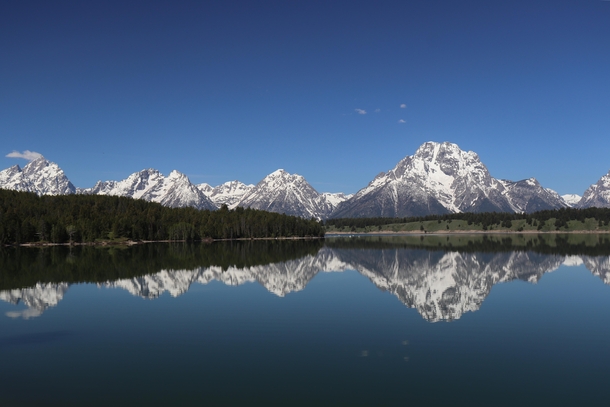 Cool picture I took last year of the Grand Tetons reflecting across Jackson Lake 