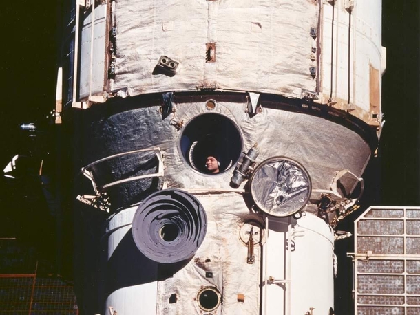 Cosmonaut looks out window on the Mir space station