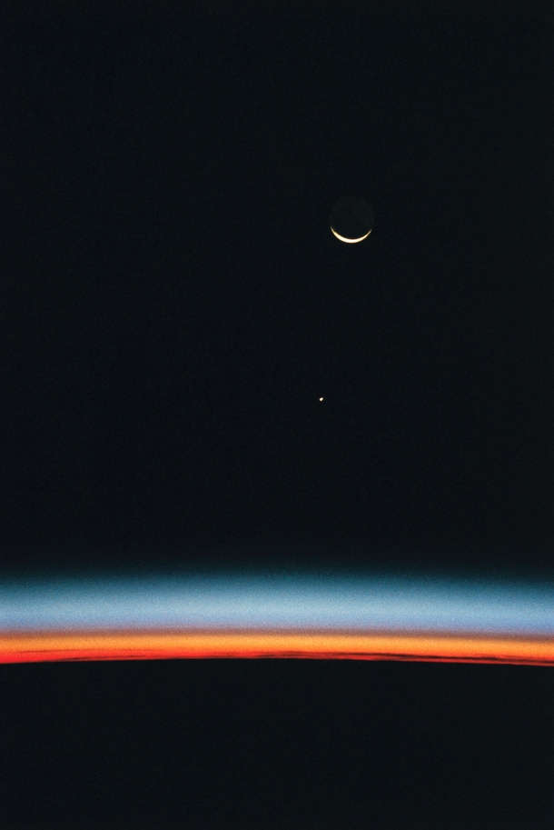 Crescent Moon and Jupiter over Earths Horizon