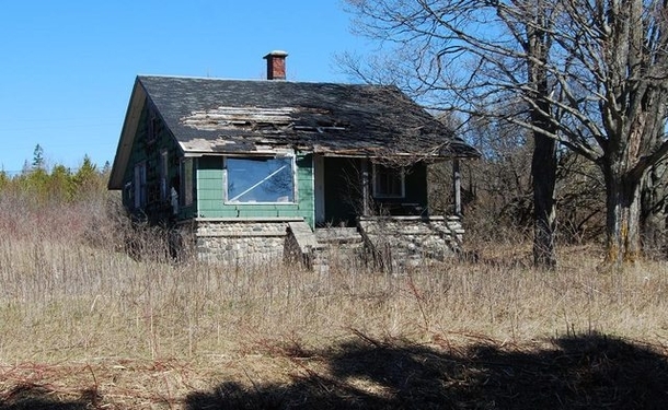 Cute green house on old US- in St Ignace Inside was still intact and filled with furniture and belongings Abandoned  