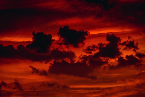 Dark clouds overlooking red sky