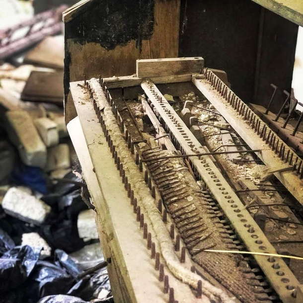 Decayin piano in an abandoned chapel