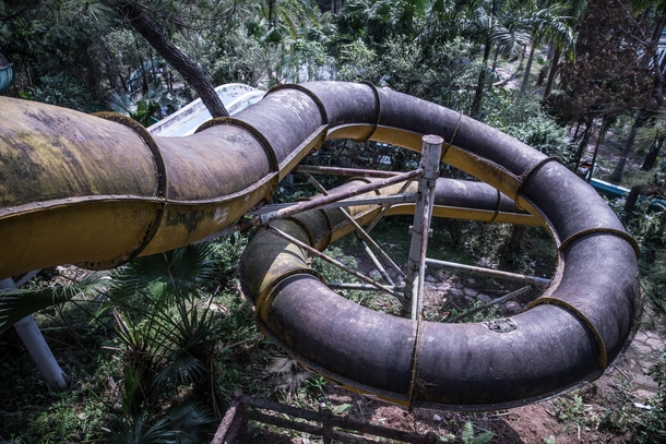 Decaying slide at an old theme park Thailand 