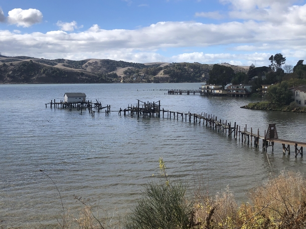 Dilapidated dock to abandoned boathouse no longer inhabited in Benicia CA
