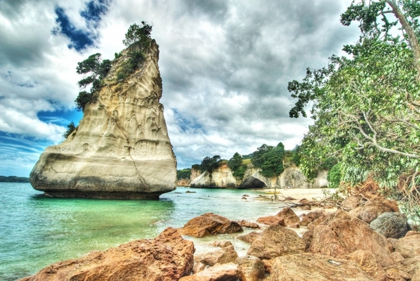 Dramatic clouds over Cathedral Cove New Zealand 