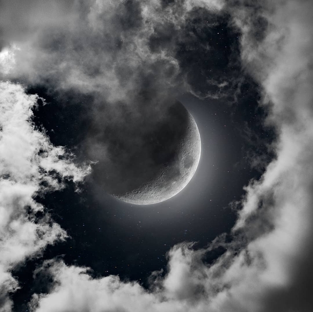 Dramatic Moon between clouds