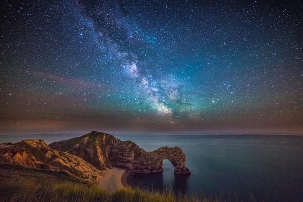 Durdle Door under the stars Dorset UK by Stephen Banks 
