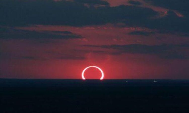 Eclipse and sunrise at the same time