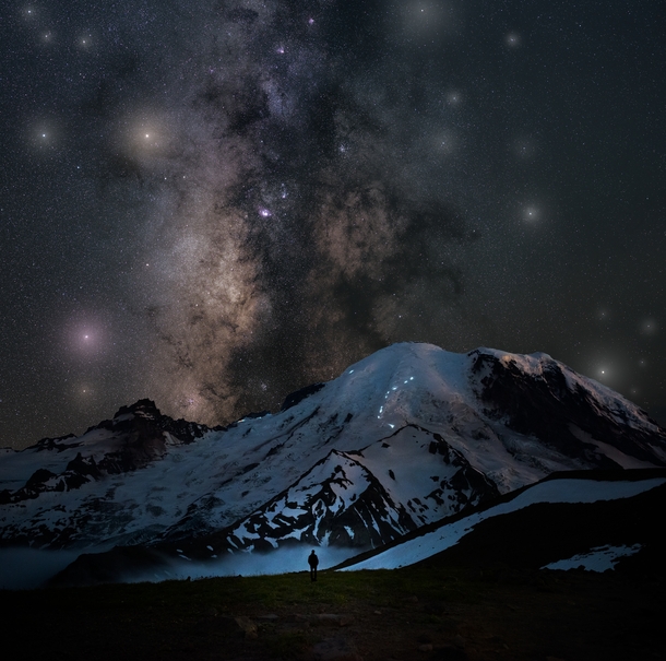 Epic view of the climbers amp their headlamps make progress towards the summit of Mt Rainier Washington underneath the Milky Way 