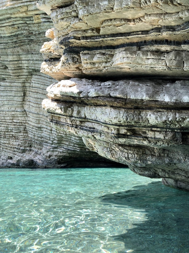 Eroded rocks and beautiful blue water of Corfu Greece 