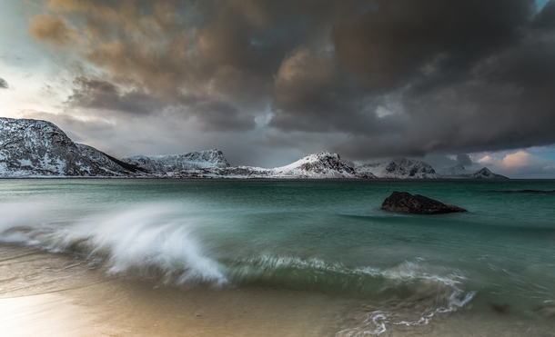 Even though it was dull weather the sea here is an incredible emerald green  I had to increase the shutter speed to get just the effect I wanted and then wait for the right wave to come along- Haukland Beach Norway  Photo by Jerry Fryer