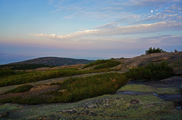 Evening light and waxing moon on Cadillac Mountain in Maines Acadia National Park Maine 