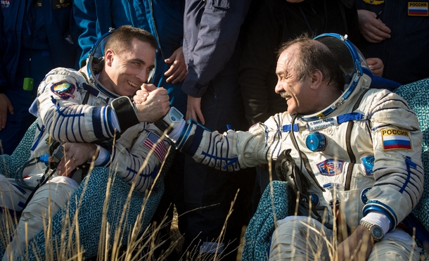 Expedition  Flight Engineer Chris Cassidy left and Commander Pavel Vinogradov of Russian Federal Space Agency shake hands after they landed their Soyuz TMA-M spacecraft 