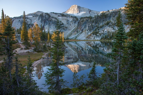 First touch of Sun on Eagle Cap Peak reflected in Mirror lake Eagle Cap Wilderness OR 