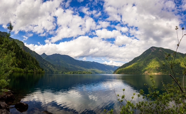 Following a landslide  years ago a river was dammed which flowed in the valley carved by glaciers during the last ice age creating Lake Crescent in Washington 