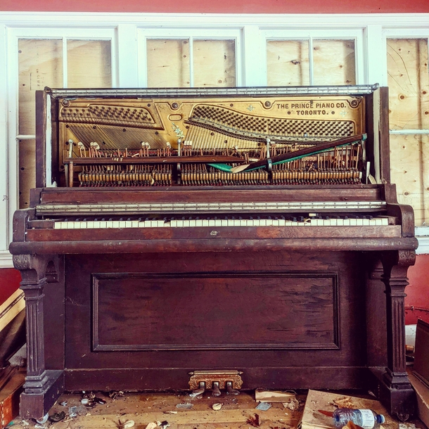 Forgotten piano in an abandoned boarding home
