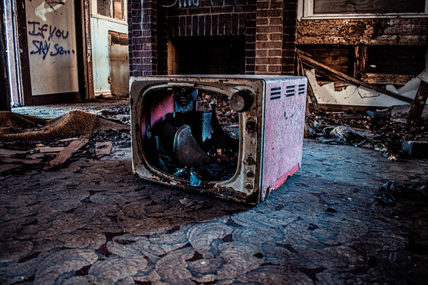 Found an abandoned house in the country today The exterior was so overgrown with vegetation that I really couldnt get a decent exterior pic but I did snap this decaying TV set in a sad living room