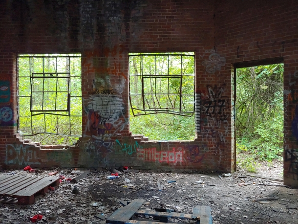 From inside a solitary brick building near a train track in Amherst Massachusetts