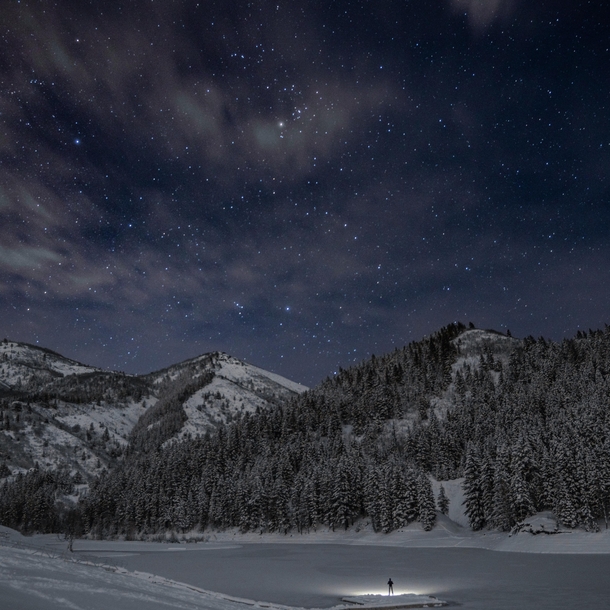 Frozen lake at night with the stars out and bright 