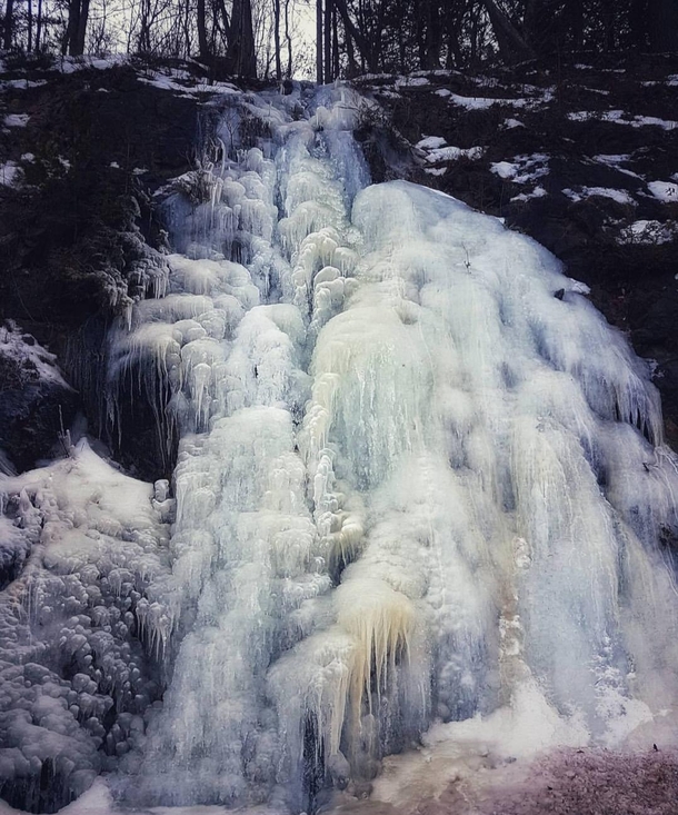 Frozen waterfall by Wolfe Lake Ontario Canada  OC