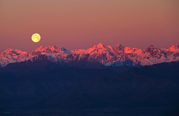 Full moon over the Alps near Turin Italy  by Stefano De Rosa 