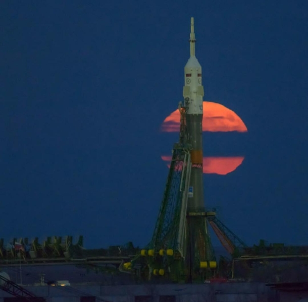 Full Moon rises behind a Soyuz rocket