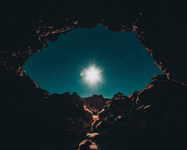 Full moon seen from a cave in Brfellsgj Iceland 