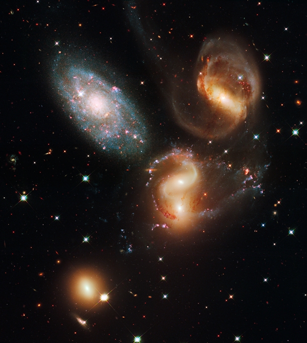 Galactic Wreckage in Stephans Quintet this image reveals a wide range of stars taken by the Hubble Space Telescope in visible and near-infrared light