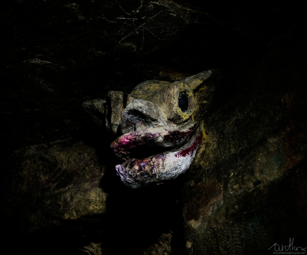gargoyle head in the Parisian catacombs utr_inf
