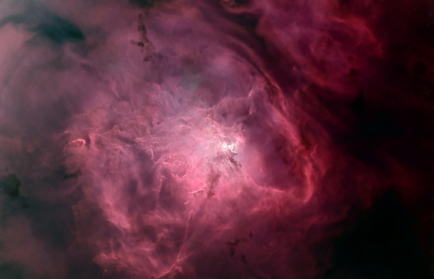 Gas and Dust of the Lagoon Nebula Spans across  Light-Years 