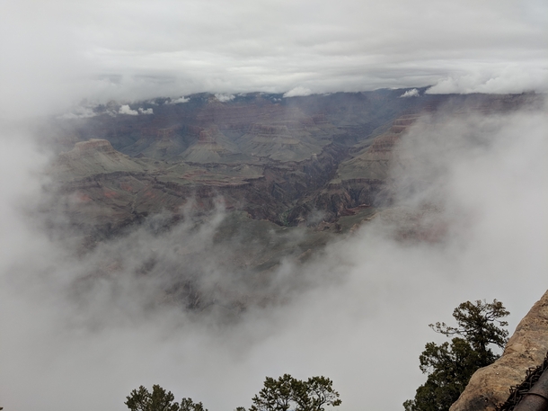 Getting a glimpse of the Grand Canyon Arizona through the fog 