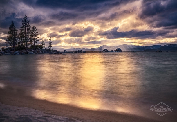 God rays spiking through spring storm clouds on the east side of Lake Tahoe Nevada 