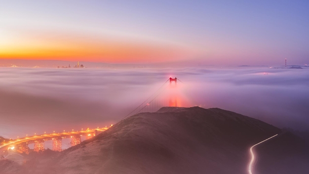 Golden Gate Bridge and San Francisco blanketed under summer fog 