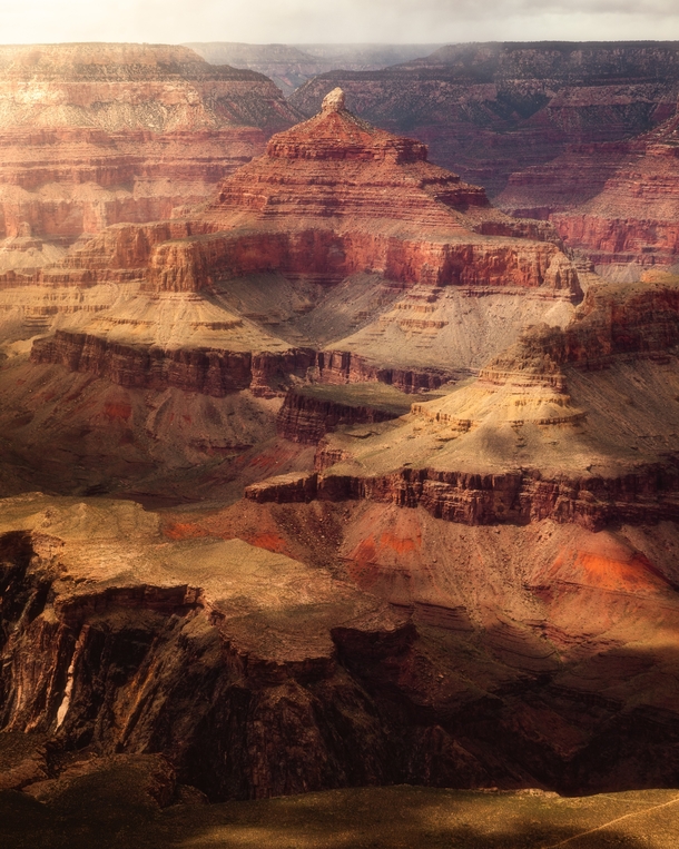 Gorgeous golden light spilling into the depth of the Grand Canyon