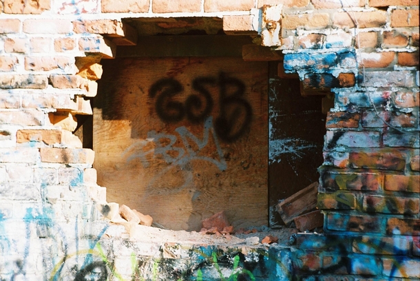 Graffiti covered broken wall