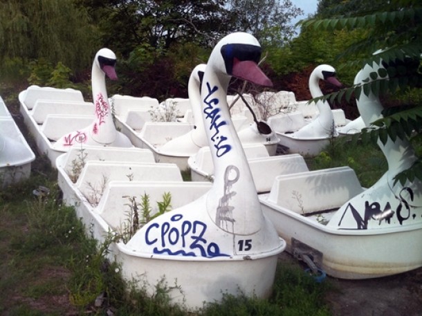 Grafitti covered swans from the abandoned swan ride at Spree Park Plnterwald in Berlin 