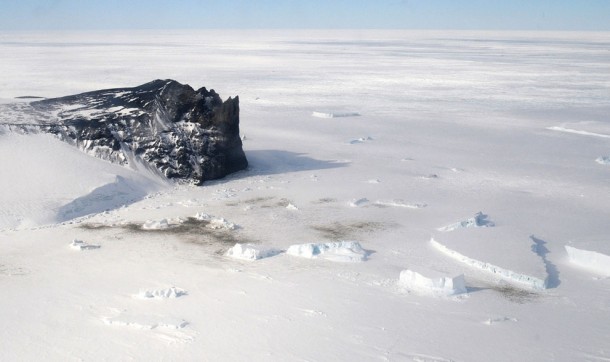 Great shot of Antarctica - the black spots on the ground are groups of emperor penguins