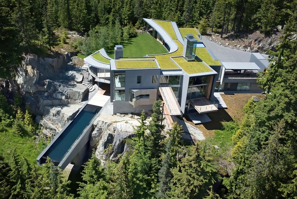 Green roof and infinity pool suspended in the air over a cliff - Whistler BC Canada