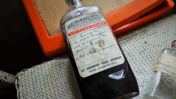 Half fullhalf empty medicine bottle at an abandoned mansion in the Uk